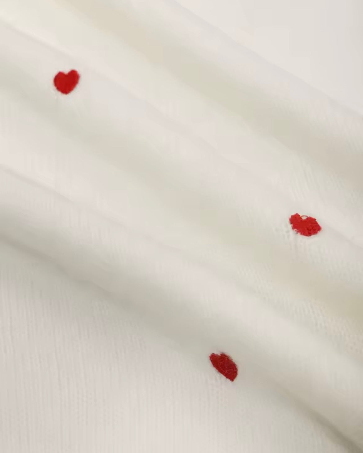 Suéter Corazones
